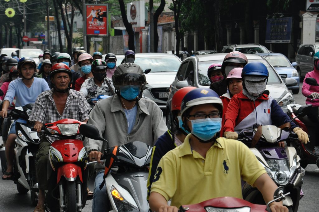 People with masks in traffic jam in Ho Chi Minh City