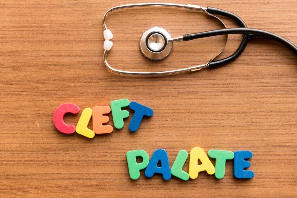 Cleft,Palate,Colorful,Word,On,The,Wooden,Background,With,Stethoscope